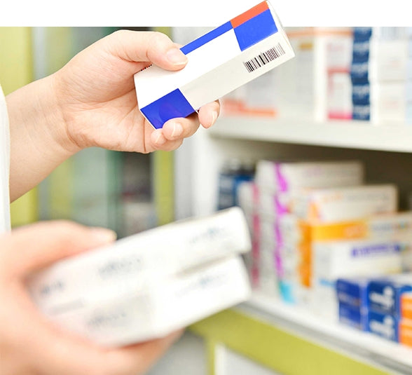 Healthcare professional reviewing pharmaceutical products
